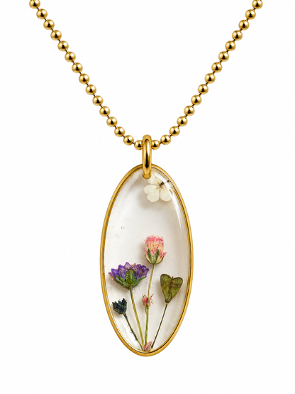 Goudkleurige ketting met transparante bloemenhanger – echte droogbloemen