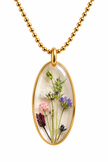 Goudkleurige ketting met transparante bloemenhanger – echte droogbloemen